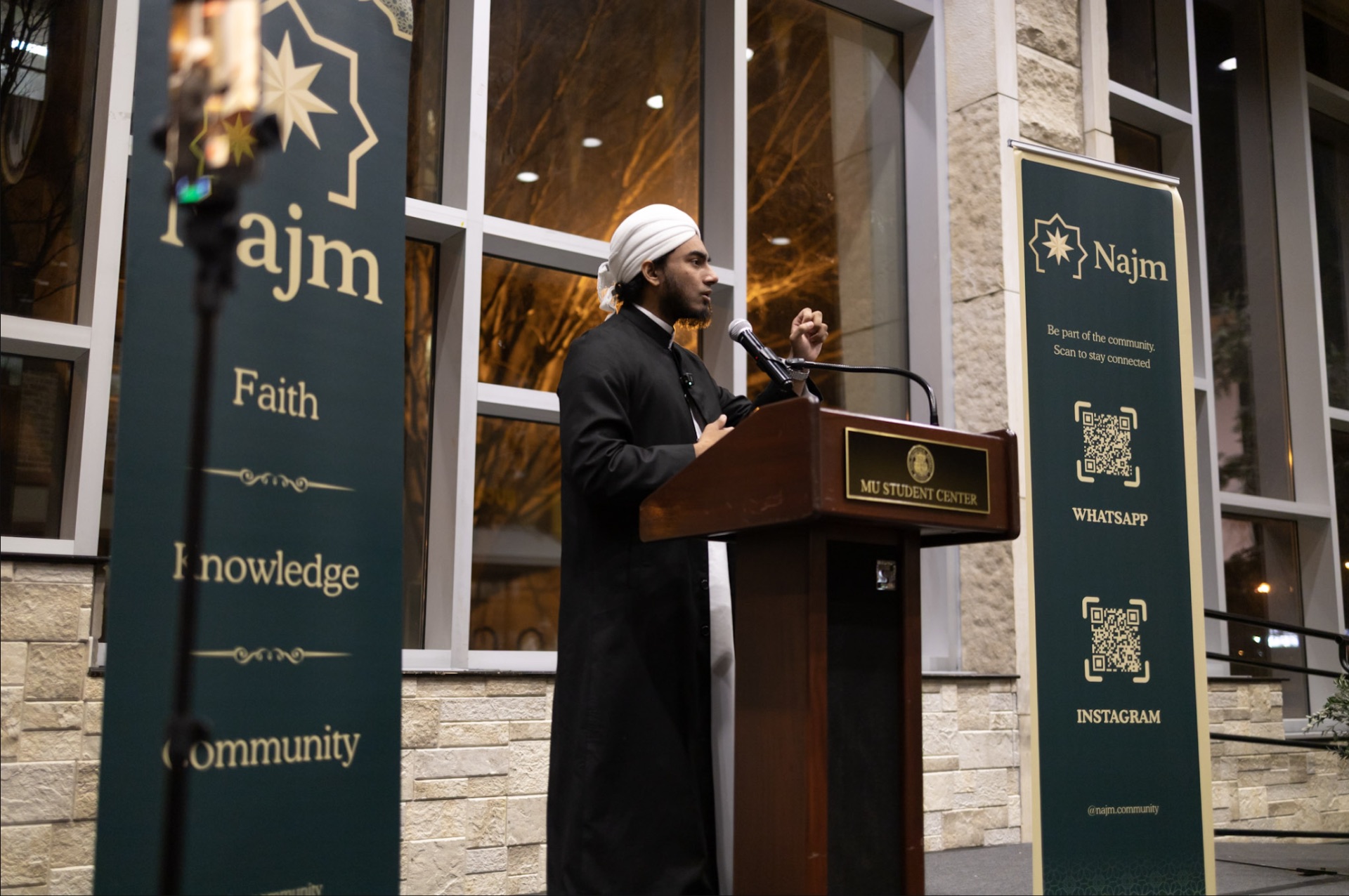 Scholar speaking at conference